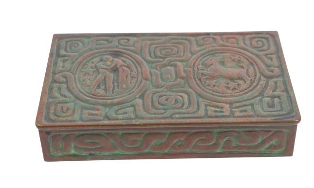 Bronze Tiffany Studios "Zodiac" Lidded Box: Original patina. Original hinged bronze box.Condition: Good5 1/2 x 3 1/2 x 1 in.Please note that all sales are final. No refunds will be given under any circumstances.