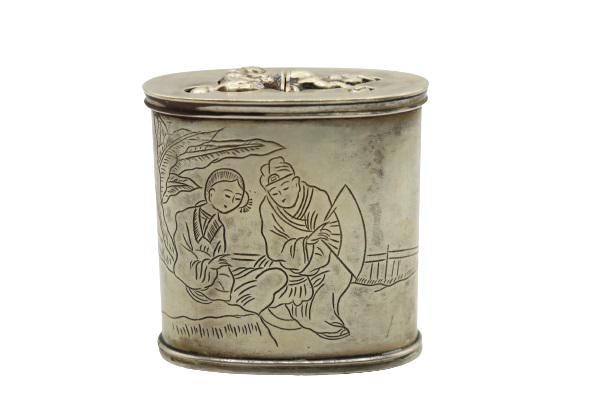 Rare Bronze & Silver Japanese Erotica Snuff Box: Antique three-part lidded box with Japanese imagery and writing, top lid comes off to reveal detailed erotica on two small snuff boxes. Punch marks on bottom. 2 1/2 x 1 1/2 inPlease note that all sale
