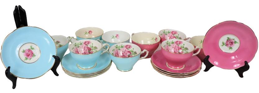 (19) Pc. English Pink & Blue Bone China Tea Set: 9 cups and 10 plates of English bone china painted blue and pink with floral design in the center.Sizes: 9 cups (5 blue, 4 pink): 2 1/2 x 3 1/2 x 4 1/2 in.10 plates (5 blue, 5 pink): 5 3/4 in. diamete