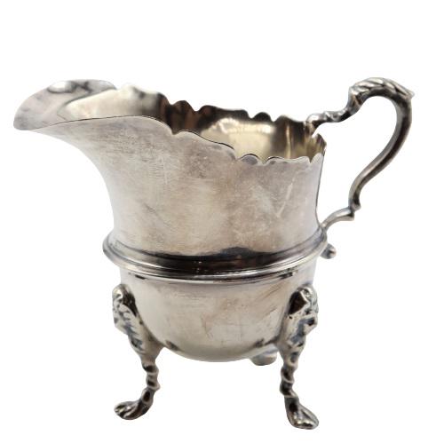 Antique English Sterling Footed Creamer 3.3 ozt.: Elegant creamer stands on three feet, marks at rim near handle. Weight: 3.345 ozt. Size: 4 x 2 x 3 1/2 in.Please note that all sales are final. No refunds will be given under any circumstances.