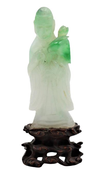 Green & White Jadeite Quanyin Figure: Green and white jadeite standing Quanyin holding a lotus on a wooden base. Size: 2 x 4 in.Please note that all sales are final. No refunds will be given under any circumstances.