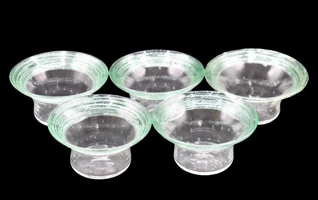 (5) Steuben Controlled Bubble Bowls: (5) Steuben controlled bubble bowls with green threading. Size: 2 1/4 x 4 1/2 in. Please note that all sales are final. No refunds will be given under any circumstances.