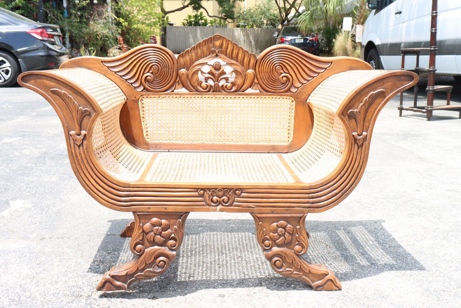 Heavily Carved Indonesian Open Arm Chair: Heavily carved Indonesian chair with fabulous open arms for comfort.Size: 45 x 22 x 30 in.Please note that all sales are final. No refunds will be given under any circumstances.