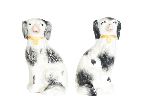 Pair of Staffordshire Dog Figures: Two Staffordshire Dog Figures, black and white.Size: 2 x 1 1/2 x 3 in. Please contact Nic at Info@premiershipment.com for an estimated shipping quote prior to bidding. Please note that all items are s
