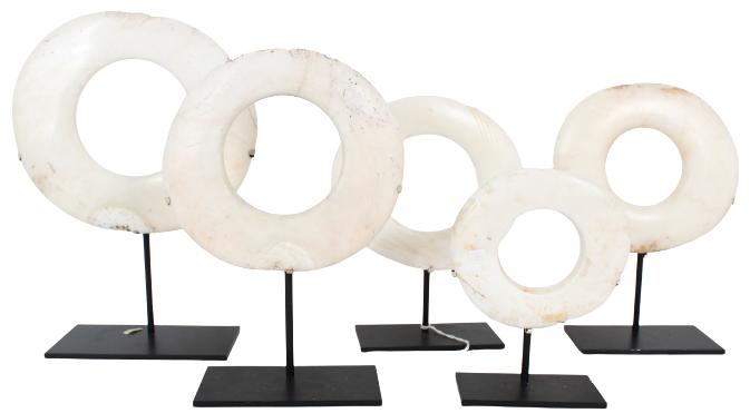 Five Unusual Abalone Discs: Each asymmetrical circular white disc, on a metal stand. Size: 10 3/4 x 4 x 14 5/8 in.