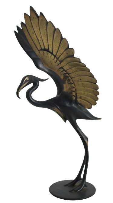 Hagenauer Bronze Crane: Circa 1930. The underside marked RR, [for Richard Rohac] Made in Austria. The two-tonepolished bronze crane with outstretched wings, on a circular stand. Size: 3 1/2 x 4 1/8 x 7 3/8 in.