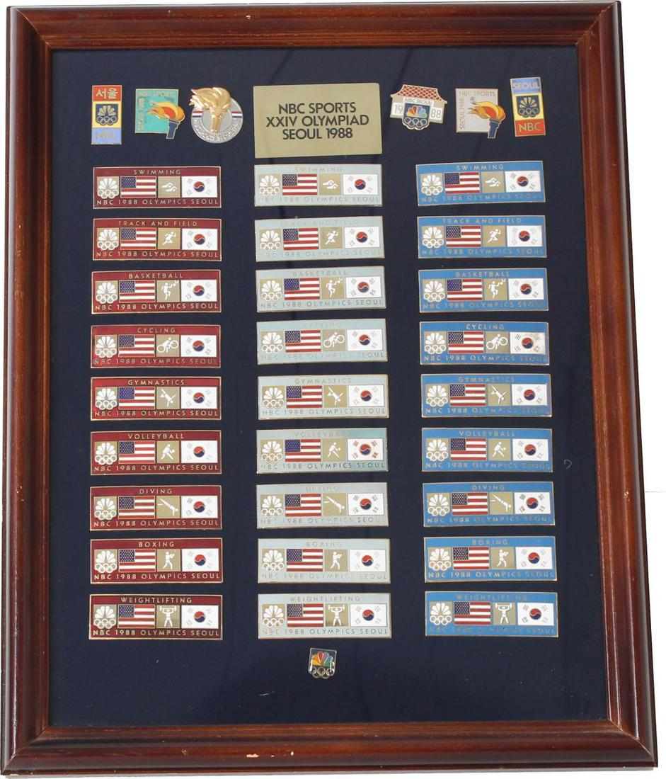 Framed NBC Sports XXIV Olympiad Pins: Framed Collection of Pins, NBC Sports XXIV Olympiad Seoul 1988. Provenance: Louis Michael Schultz â€“An Advertising Manâ€™s Ad ManAn ad man of exceptional vision and depth. To say that Lou S