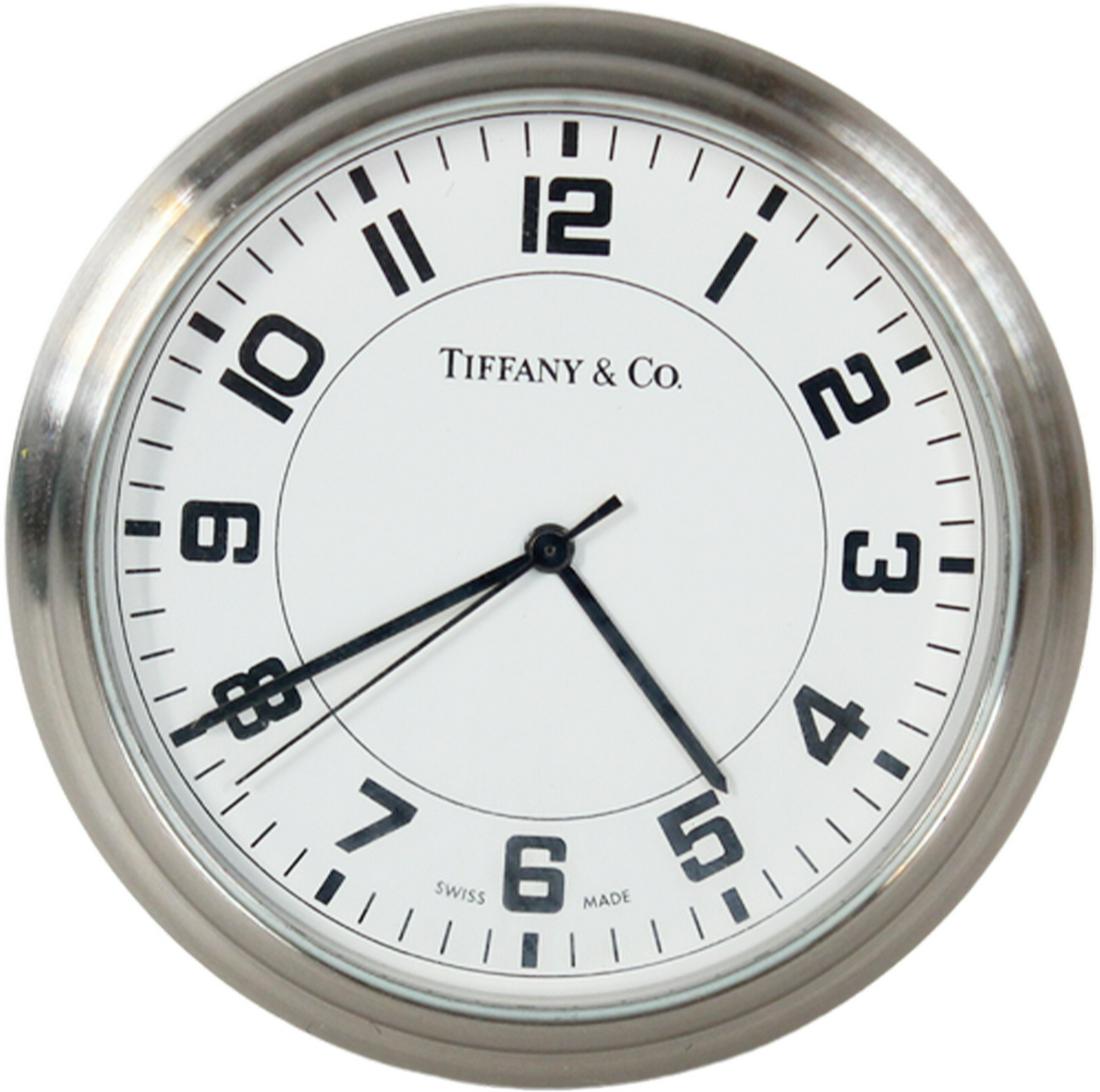 Stainless Steel Tiffany & Co Travel Gift Clock: Stainless Steel Tiffany & Co Travel Clock and Pill Box marked: Coldwell Banker Residential Brokerage Top 50 2006. Tiffany bag included. Size: 2 x 2 x 1 1/8 in.