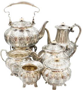 6 Pc English Sterling Silver Tea Set, 164.29ozt: English Sterling Silver Melon Shaped Tea Set, Six Piece. Hand Chased with bone finials. One finial darkened with age.Approx 164 oztSize of largest: 9 x 6 x 10 in.