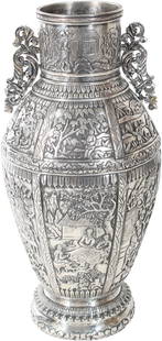 Exquisite Chinese Silver Urn 33 OZT: Exquisite Chinese silver urn with scroll handles and exterior scene design. Marked on the underside. Approximately 33 OZT.Size: 5 1/2 x 11 3/4 in.