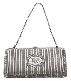 Ladies Sterling Silver Hand Clutch, 5 OZT: Ladies sterling Silver Hand Clutch, approximately 5 OZT. Monogrammed and marked sterling on the clasp. Leather interior. Size: 5 1/4 x 3 x 1/2 in.