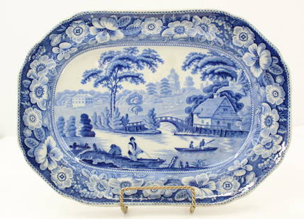 Blue And White Wild Rose Platter: Small mark on underside. Wild Rose pattern along border on top. Scene featuring an English country estate, depicts Nuneham Park and House. Based upon an engraving by W. Cooke after a drawing by S. Owe