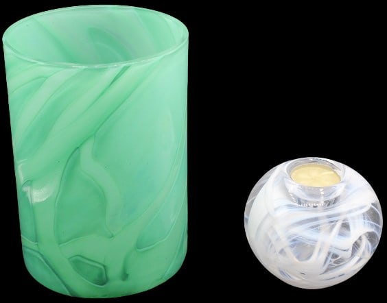 (2) Kosta Boda Pieces: Vase & Votive: (2) Kosta Boda items: a teal green vertical swirling patterned vase signed A. Ehrner, and a white swirl in clear crystal orb that holds one votive candle.Vase size: 5 3/8 x 5 3/8 x 7 5/8 in. Votive di