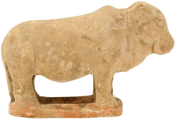 Tang Unglazed Earthenware Model of an Ox: Tang Unglazed Earthenware Model of an Ox. (618-907). Atop an oval base, with red pigment. (repairs, minor loss). Size: 6 x 2 1/2 x 4 in. #1944 #3