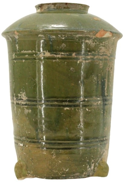 Chinese Green Glazed Earthenware Granary: Chinese Green Glazed Earthenware Granary. Tang/Ming Dynasty) The cylindrical body with molded bands, with an overhanging roof and circular opening, raised on stylized tripod feet. (losses to glaze, ch