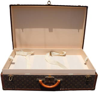 Louis Vuitton Small Monogram Canvas Suitcase: Small Louis Vuitton monogram canvas suitcase. Serial number #947982. With the iconic monogram canvas. Includes Certificate of Authenticity. Size: 31 1/2 x 20 1/2 x 8 1/2 in. Louis Vuitton's heritage