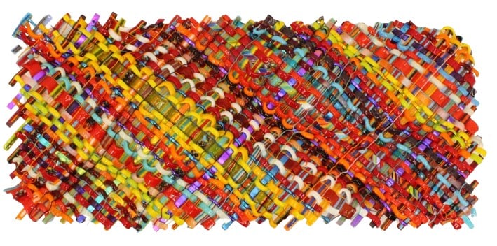 Mark Lewanski (21st Century) American, Woven Glass Sculpture: Mark Lewanski (American, 21st Century) woven glass sculpture. Gorgeous and vibrant multi-colored woven glass sculpture, with gentle undulations that cause the piece to resemble cloth in motion. Size: 