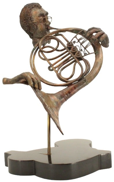 H. Mitchell Allen Sculpture of Horn Player: H. Mitchell Allen sculpture depicting disembodied head and hands playing the French horn. Signed and dated, H. Mitchell Allen '86.Size: 14 x 17 x 23 in. #2136