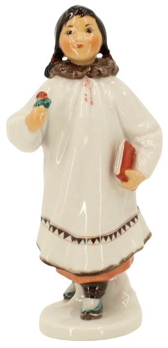 USSR Porcelain Figure of Yakut Inuit Girl: Porcelain figure of Yakut Inuit girl, book tucked under left arm, presenting a small flower. Marked on base Made in USSR.Size: 4 x 3 x 8 in. #2399 Location B1
