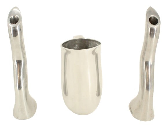 Nambé Pitcher by Neil Cohen (B 1960) and Two Ikea Candlesticks by Anna Efverlund (B 1950): Nambé Pitcher by Neil Cohen (B 1960) and Two Ikea Candlesticks by Anna Efverlund (B 1950). All primarily aluminum, in abstract modern designs. Artist name and company information on bottom