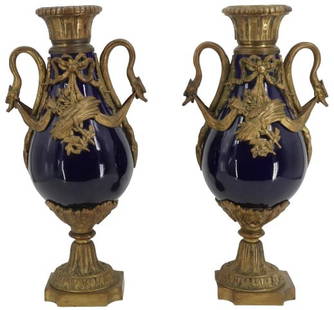 Pair of 19th Century French Gilt Bronze Porcelain Cassolette: Pair of 19th Century French Gilt Bronze Porcelain Cassolette. Cobalt blue ground, gilt bronze mounts. Sevres style. There is a minor hairline to the belly of one of the vases.Size: 9 x 5 x 18 1/2