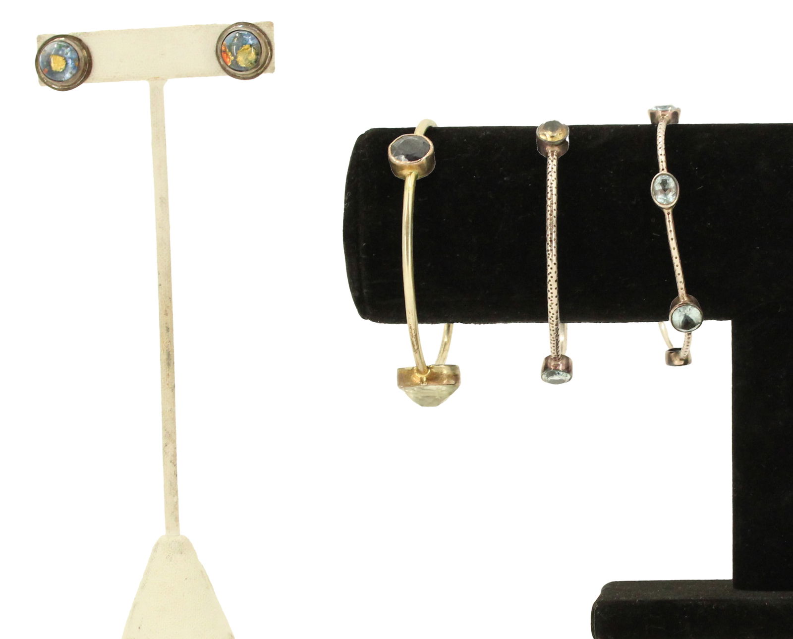 (3) Sterling Silver Jewelry Pieces: Round earrings set in silver. Glass with flecks of blue, gold, and orange colors embedded within. For pierced ears. Two silver bangles with three round cut stones. Marked on inside. Silver