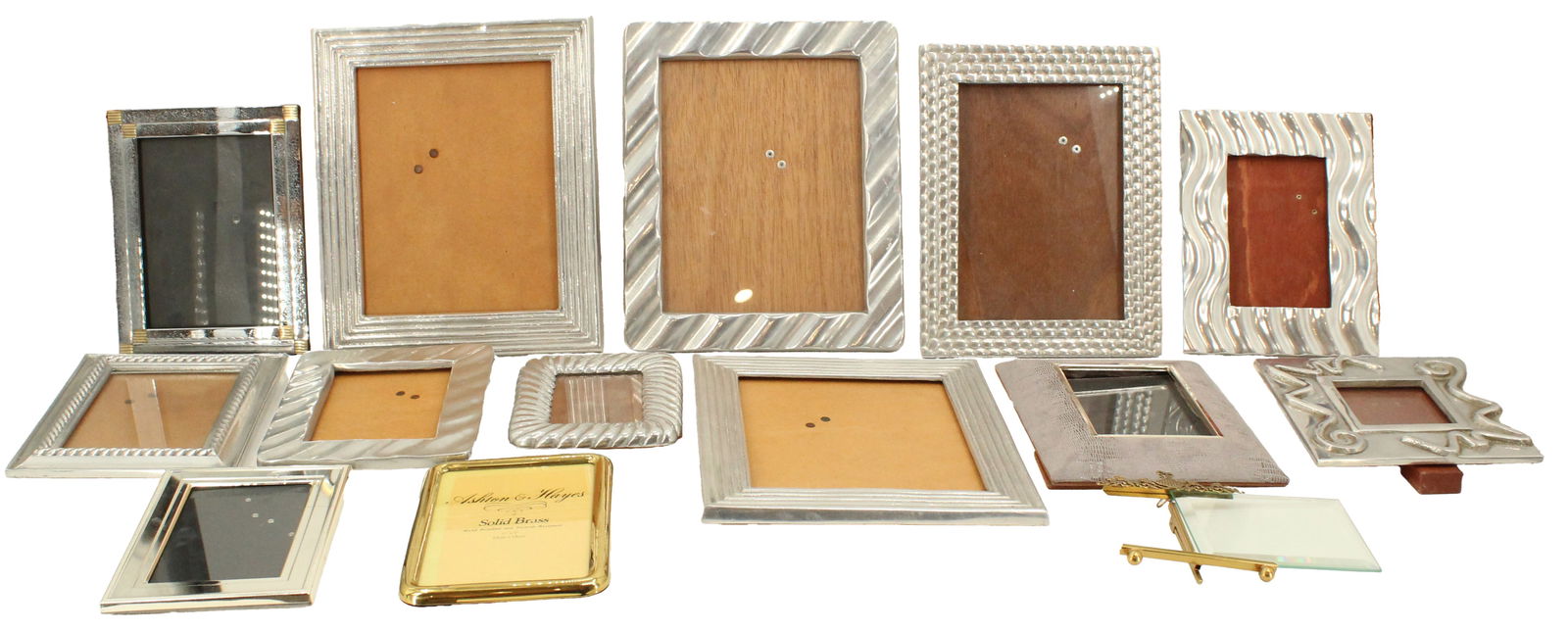 (14) Desk Picture Frames: Lot comprised of fourteen small picture frames of various sizes, styles, and materials, including metal, silverplate, and brass. Condition: Commensurate with age. Largest with stand o