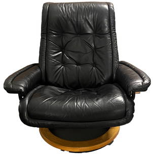 Norwegian Ekornes Stressless Black Reclining Chair: Vintage Norwegian Ekornes Stressless Black Reclining and Swiveling Chair. Comfortable leather upholstery and teakwood support. Marked on metal bar. Size: 46 x 34 x 38 1/2 in. The