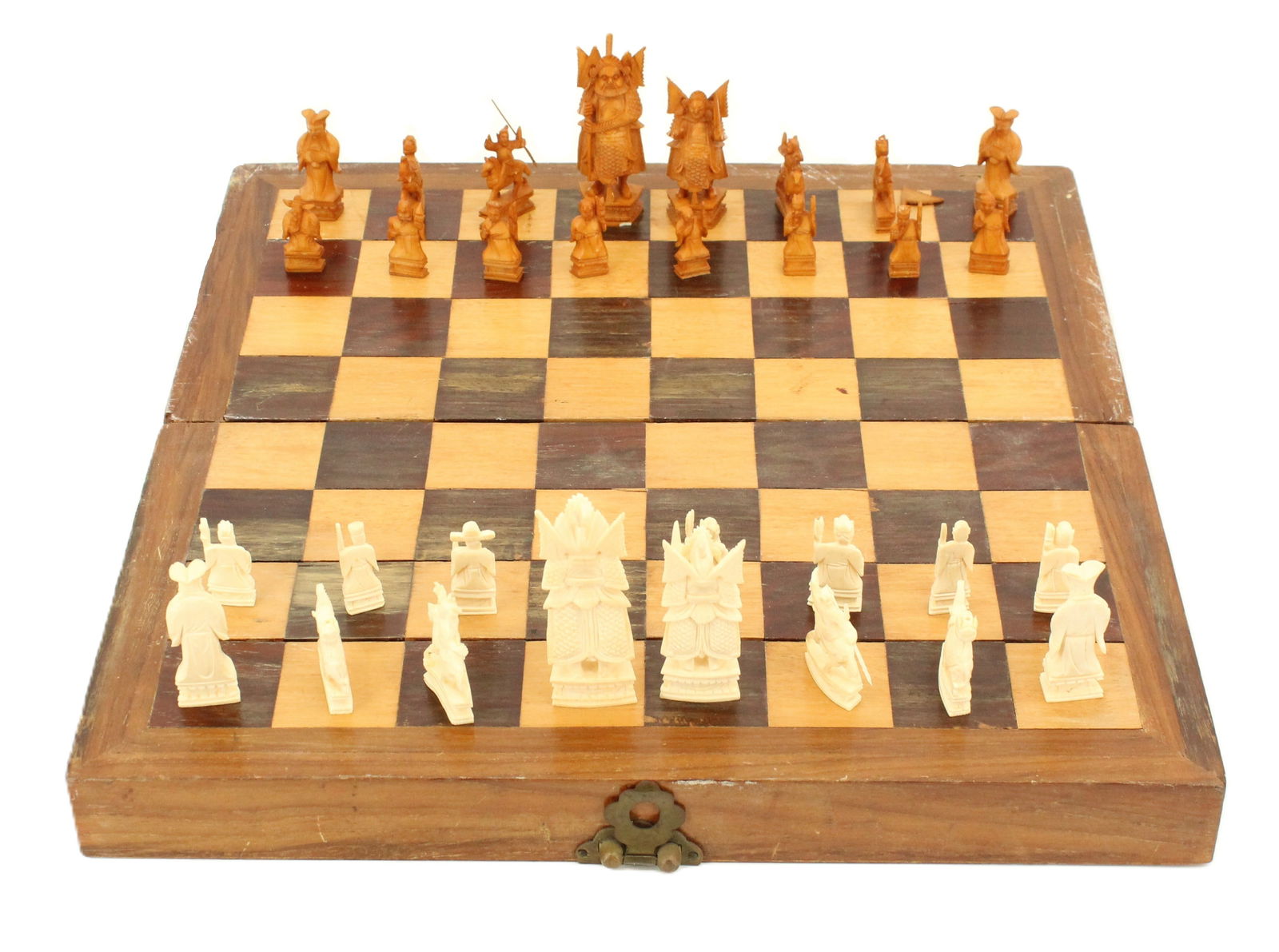 Asian Hand Carved 32 Piece Wood and Bone Chess Set AS IS: Asian Hand Carved 32 Piece Wood and Bone Chess Set AS IS. Each piece is hand carved and unique, no two pieces are the same. Some pieces are missing flags, feathers, or spears. The flag of a rook is de