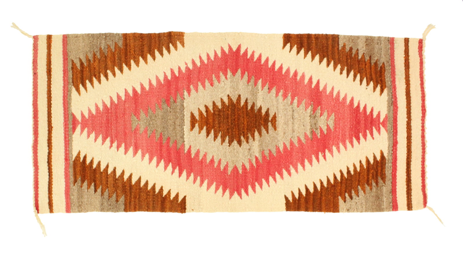 Navajo Ganado Squash Blossom Rug: Navajo Ganado Squash Blossom Rug. Central jagged diamond with alternating colors expanding to the edges, in browns, pinks, greys, and white tones. Size: 36 1/2 x 16 1/2 in. #5392 . N