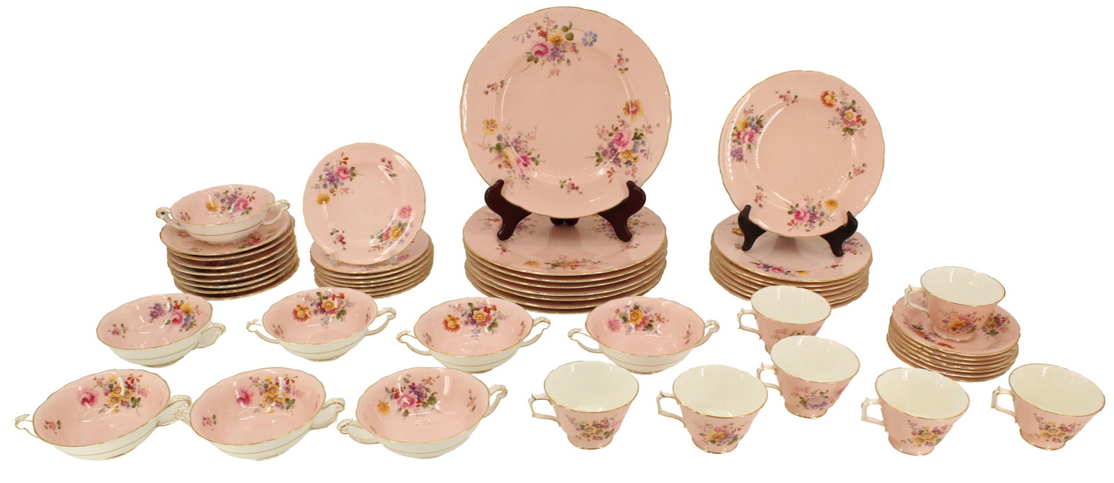 Vintage 54 Piece English Royal Crown Derby Porcelain Tea Set, 1939 to 1940: Vintage 54 Piece English Royal Crown Derby Porcelain Tea Set, 1939 to 1940. Delicately painted pink with floral shapes and patterns. Markings on the bases include "II" and "III," indicating the years 