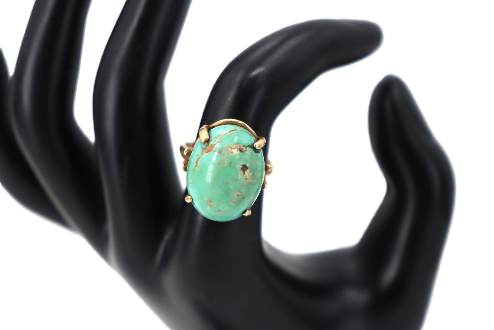 Tested 14k Gold and Quartz Ring - Gross 6.4 g.: Tested 14k Gold and Quartz Ring. Features an oval quartz gemstone with a soft greenish-blue hue, exhibiting natural veining and inclusions that add character. Secured by sturdy yellow gold prong