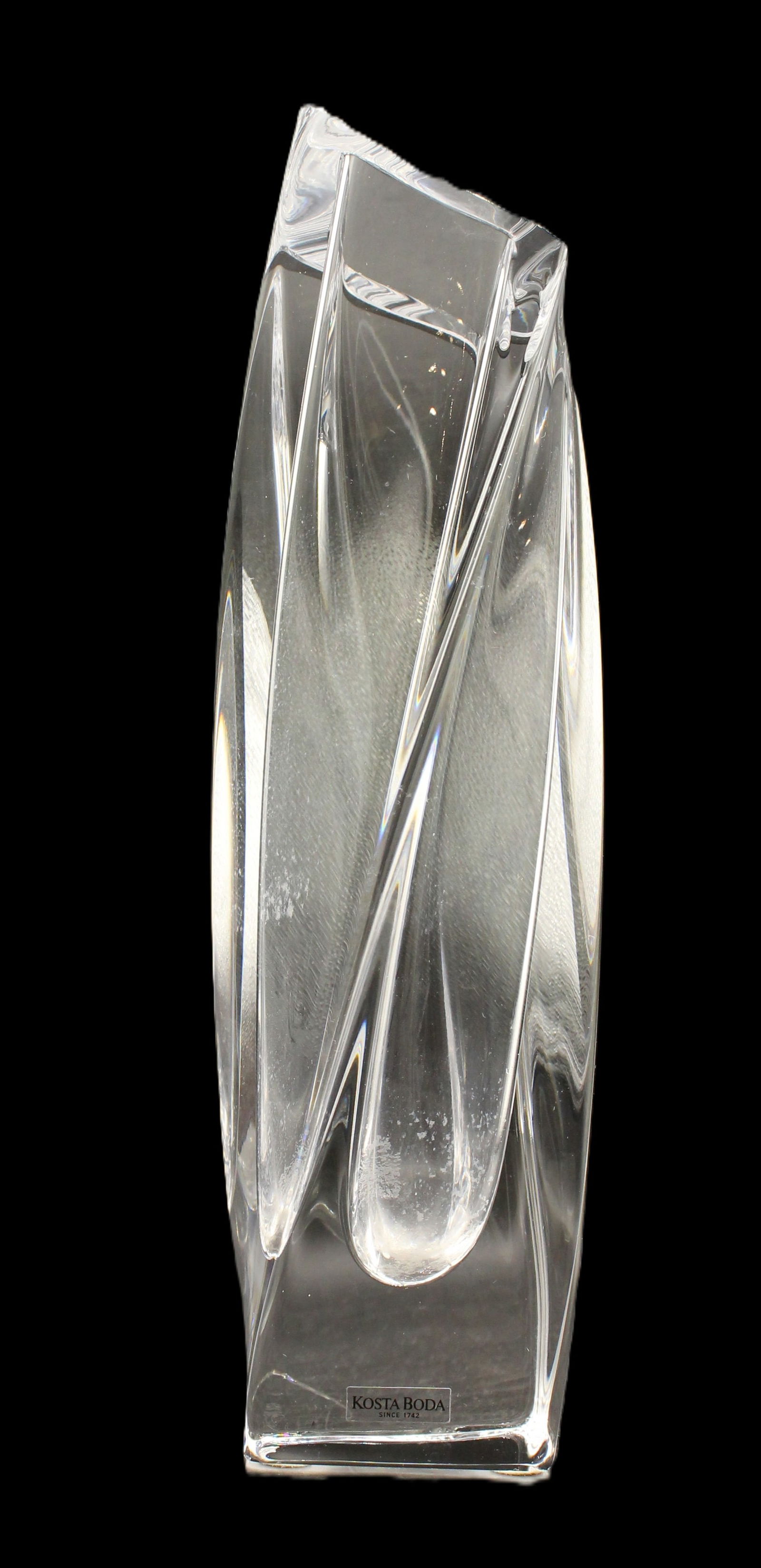 Kosta Boda Vase: Kosta Boda Vase. A twisted clear crystal multifaceted vase designed by Goran Warff in 1986. Signed on the base. Size: 3 x 3 x 11 1/4 in. #6466