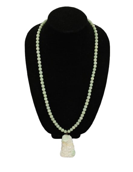 Jade Necklace AS IS: Jade Necklace AS IS. Small round green jade beads with carved jade pendant. Intricate ornate carving. Oval shaped with a flat back and curved front. Condition: Jade reglued. Size: 1 3/4 x 17 in.