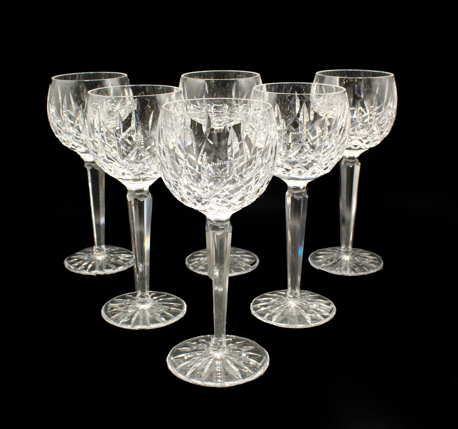 (6) Waterford Cut Crystal Lismore Wine Hocks: (6) Waterford Cut Crystal Lismore Wine Hocks. The Lismore pattern is one of Waterford's most iconic designs, known for its diamond and wedge cuts. These are specifically wine hocks, which are