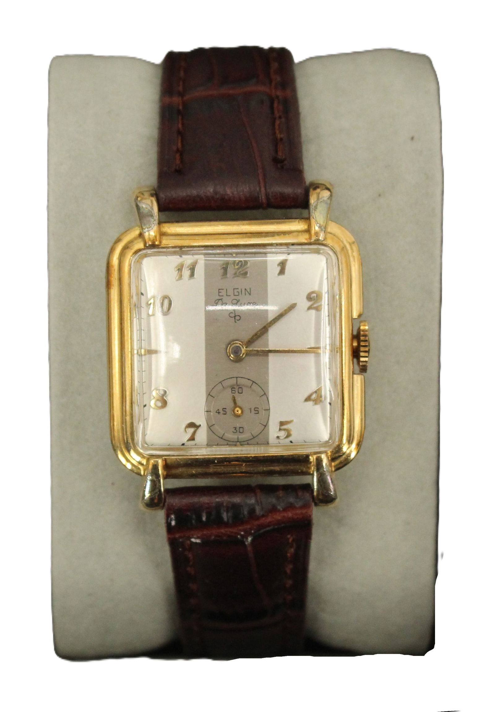 Elgin DeLuxe 10K Gold Filled Wristwatch with Leather Band, AS IS: Elgin DeLuxe 10K Gold Filled Wristwatch with Leather Band, AS IS. Grey striped rounded square face with all numbers except 3, 6, and 9, the space for the 6 replaced by a circular second hand timer wit
