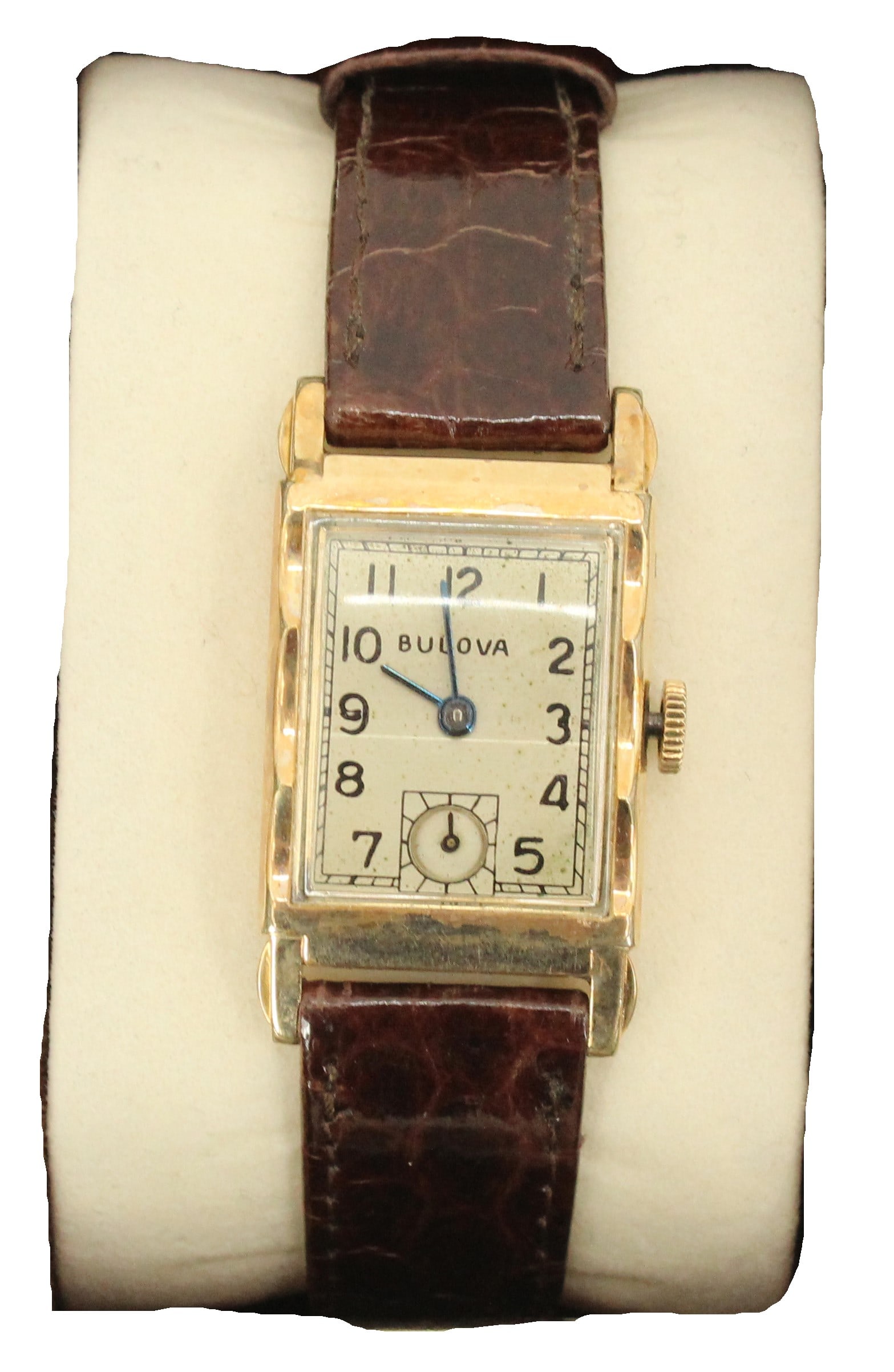 Bulova 10K Gold Filled Wristwatch with Genuine Sea Snake Band, AS IS: Bulova 10K Gold Filled Wristwatch with Genuine Sea Snake Band, AS IS. 10K marked on back of watch and sea snake marked on back of band. Rectangular face with numbers, the number 6 replaced by a circul