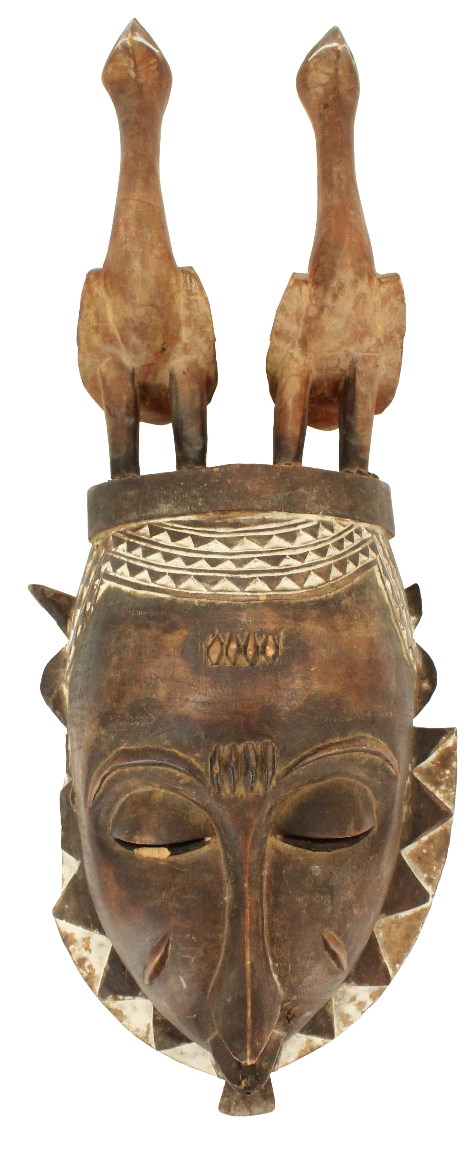 African Mask of the Yaoure People AS IS: African Mask of the Yaoure People AS IS. Ivory Coast. Carved wood with colored pigments. Loman type, topped with figures of birds. Condition: Condition as pictured. AS IS. Size: 8 1/2 x 20