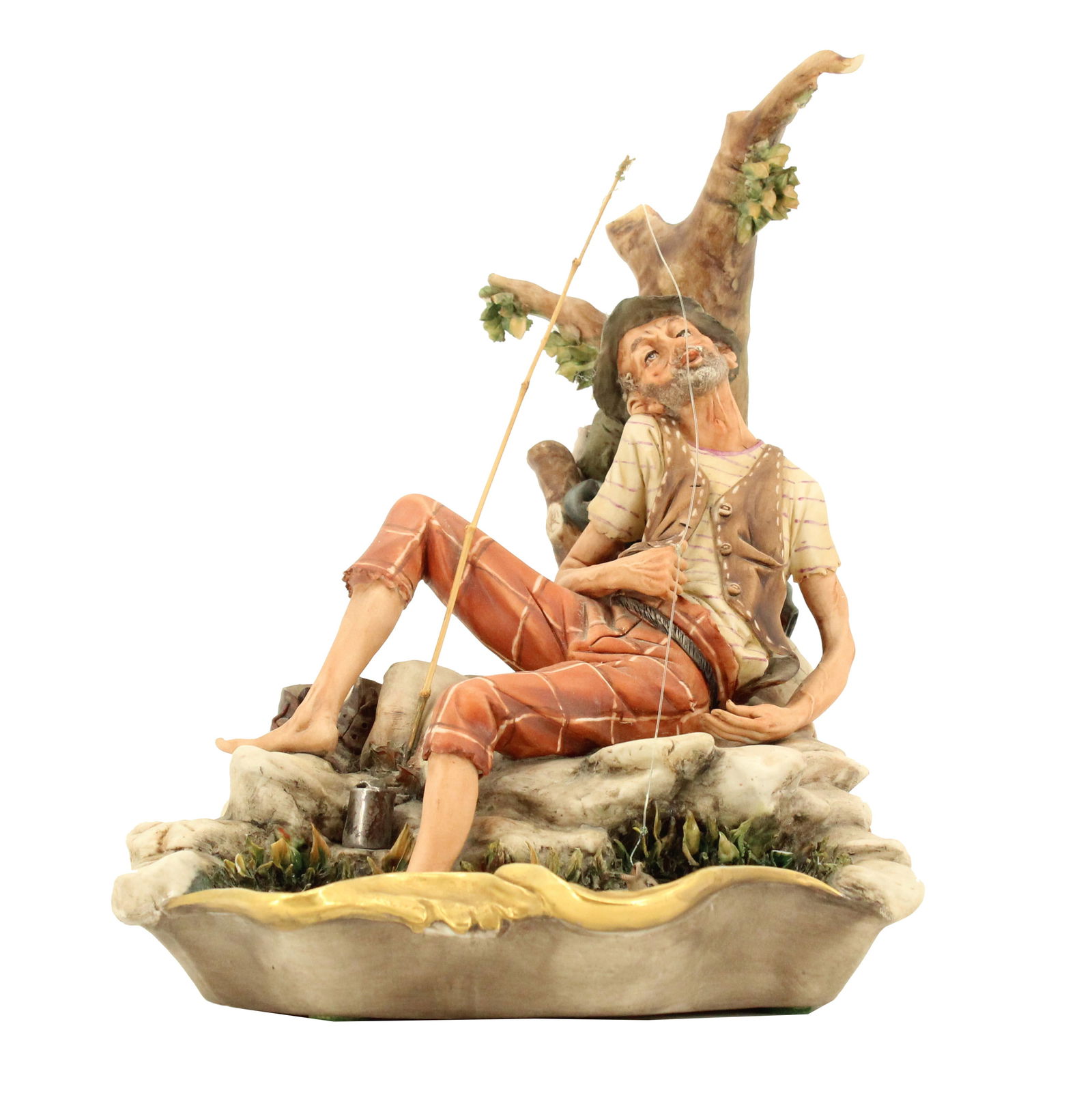 Dino Bonalberti (20th Century) Italian, 1970s Capodimonte Painted Porcelain Fisherman: Dino Bonalberti (Italian, 20th Century) 1970s Capodimonte Painted Porcelain Fisherman. Painted porcelain figure of a fisherman reclining against a tree. Blue Capodimonte stamp on base. Marked Works of
