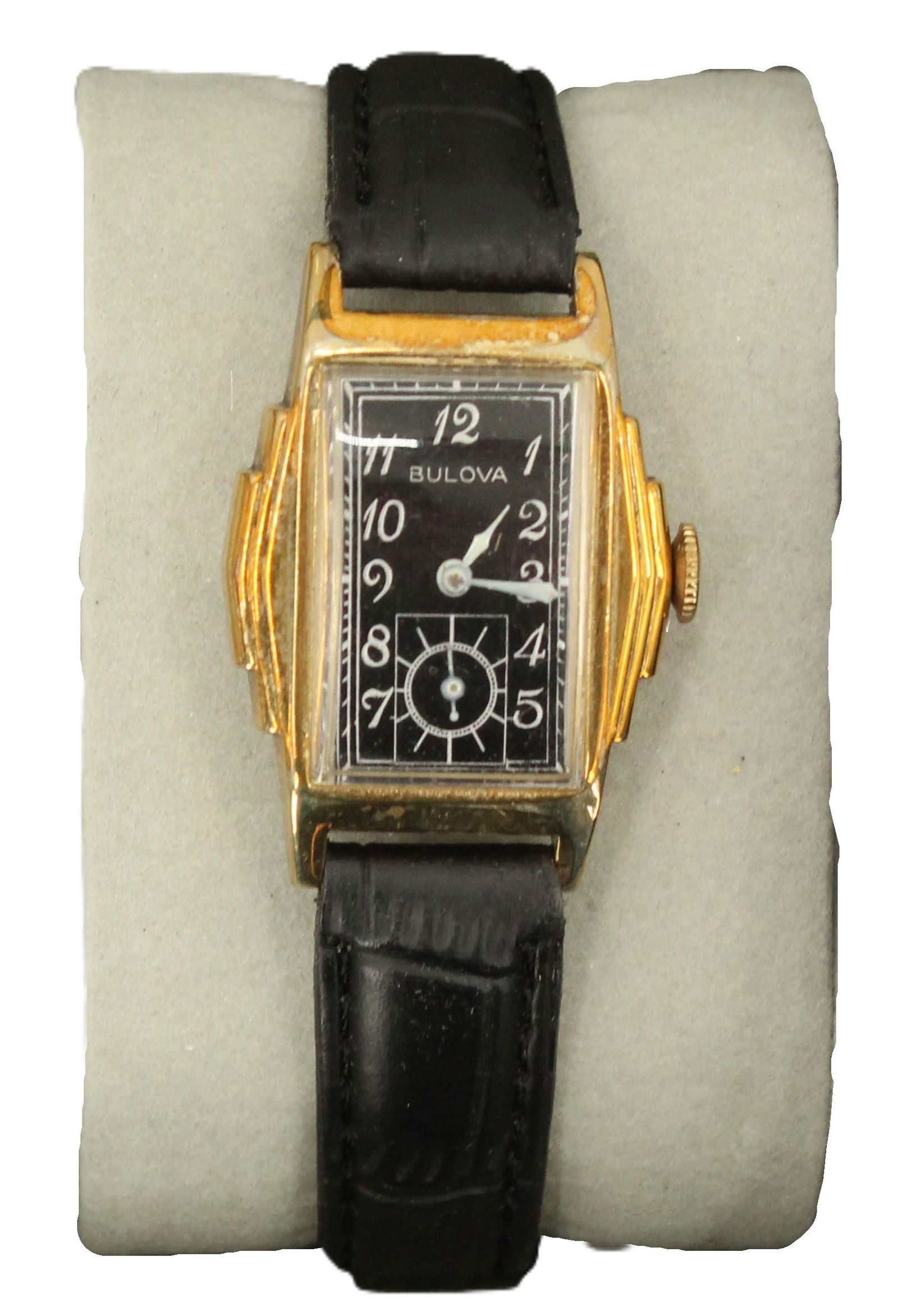 Bulova 15 Jewels Metal Wristwatch with Leather Band, AS IS: Bulova 15 Jewels Metal Wristwatch with Leather Band, AS IS. Rectangular black face with numbers, the number 6 replaced with a circular second hand timer. We cannot guarantee the working conditio