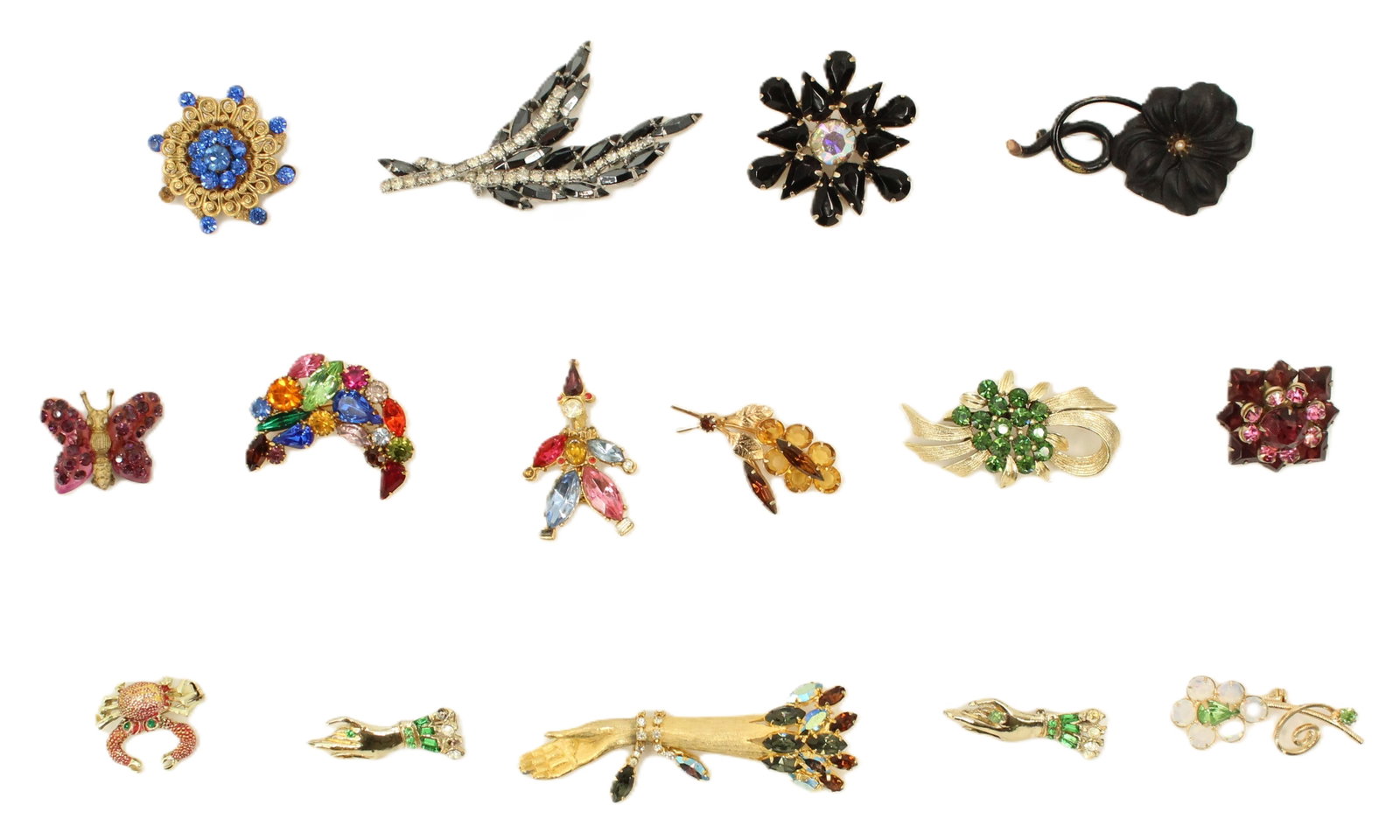 (15) Vintage Costume Jewelry Brooches: (15) Vintage Costume Jewelry Brooches. Range of designs from floral motifs, animal motifs, abstract shapes and patterns, and figurative designs. Multi-stones. Size: 1 x 3 1/4 in. 