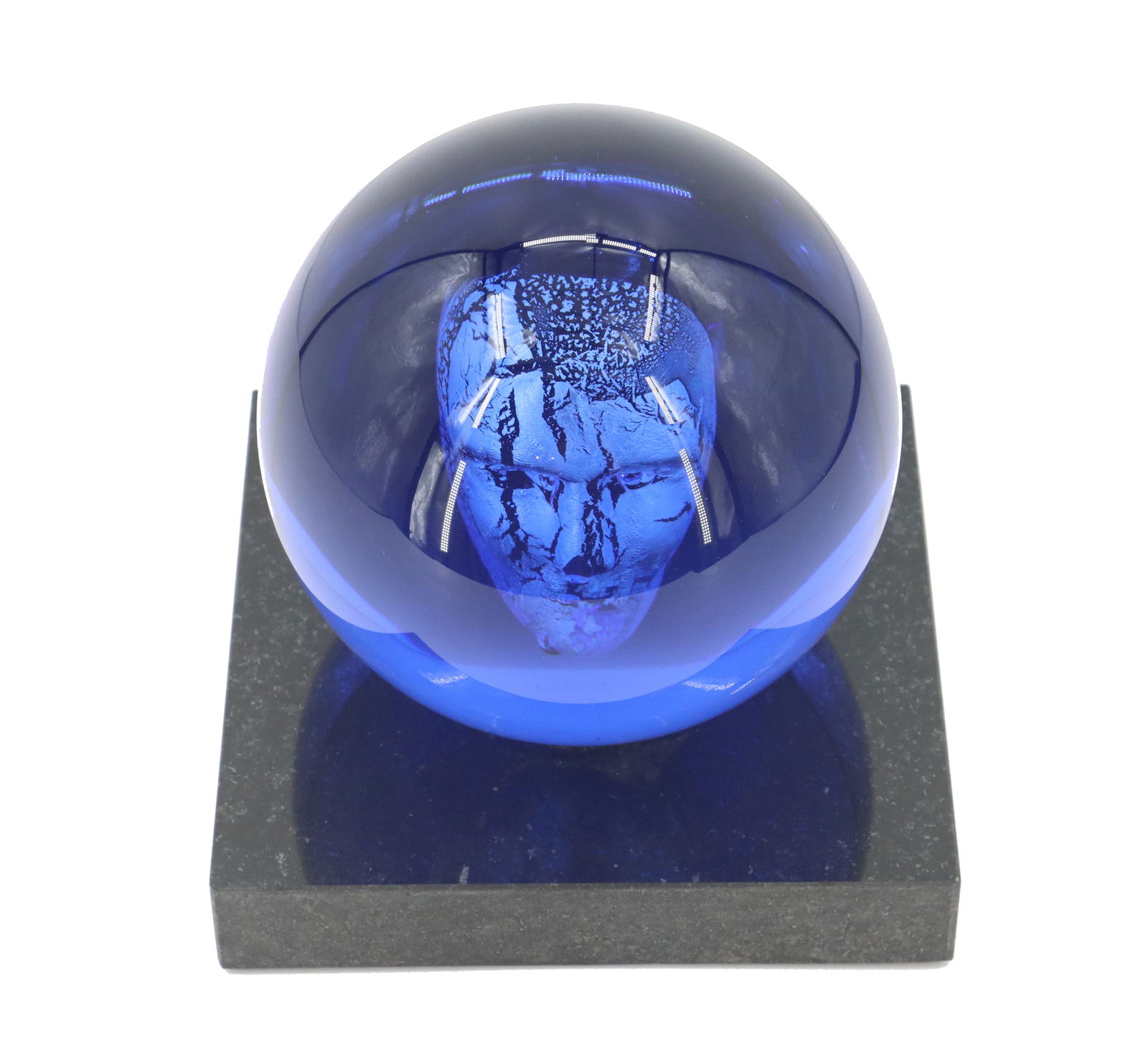 Bertil Vallien for Kosta Boda Figural Sculpture: Berfil Vallien for Kosta Boda Figural Sculpture. Signed on underside. Featuring a spherical, deep blue glass encasement containing a textured, abstract blue glass head within. The glass sphere r
