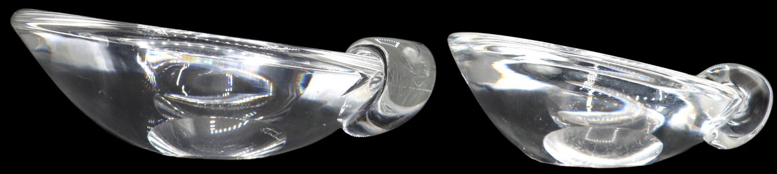 Steuben Modernist Art Glass Ashtrays or Thumb Bowls in Original Bag: Steuben Modernist Art Glass Ashtrays or Thumb Bowls in Original Bag. Sloping bowl shape with small curved grip on lower edge, never used. Signed on bases. Grey cloth drawstring bag. Size of Larg