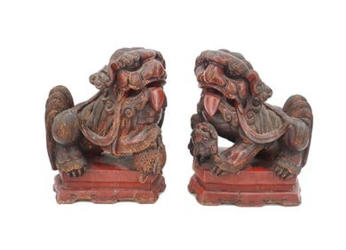 Pair of Antique Carved Wooden Foo Dogs with Worn Red Finish