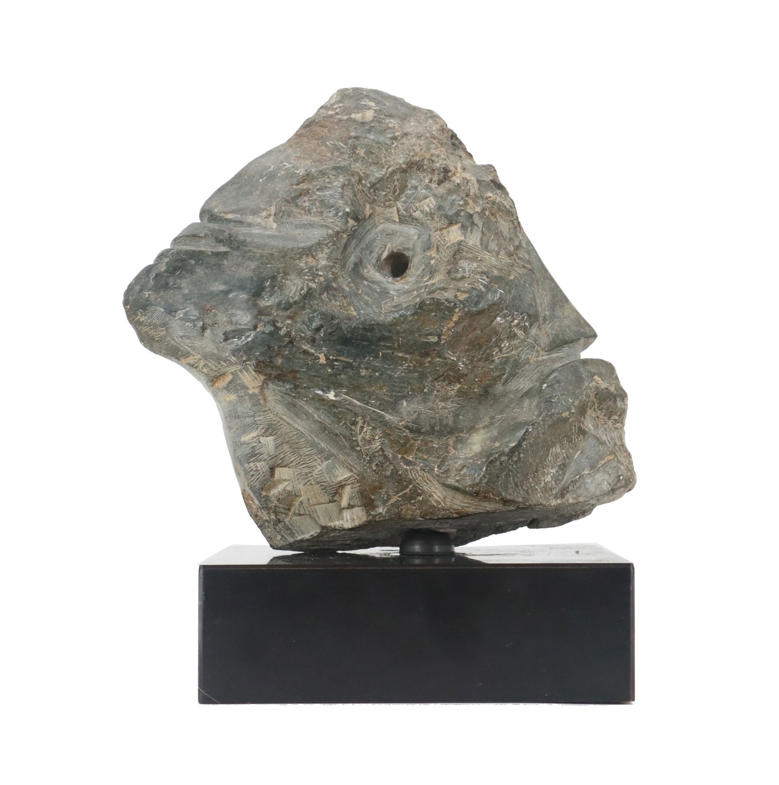 Carved Stone Sculpture On Base In The Form of A Face: Carved Stone Sculpture On Base In The Form of A Face. Likely Tribal and likely from the Northwest based upon the material and technique. Size: 8 x 10 in.