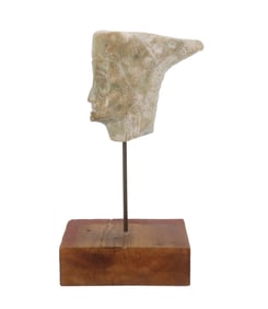 Carved Light Stone Sculpture of Elongated Face On Wooden Base With Rod