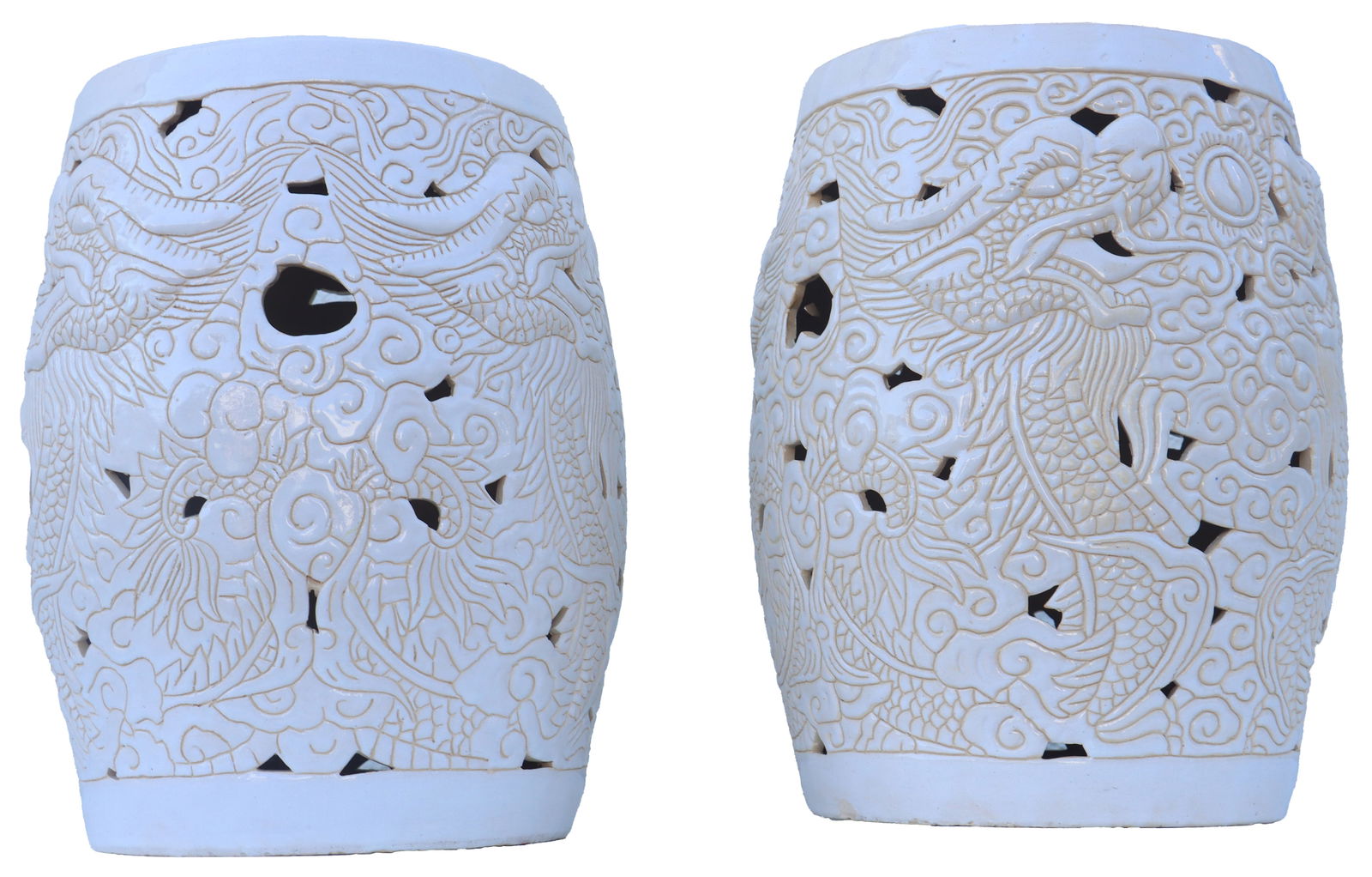 Pair of Chinoiserie Ornate Off White Ceramic Garden Seats: Pair of Chinoiserie Ornate Off White Ceramic Garden Seats. Carved with dragons and floral patterns, with small holes throughout in seemingly random spaces. Hollow, with one end open and the other flat