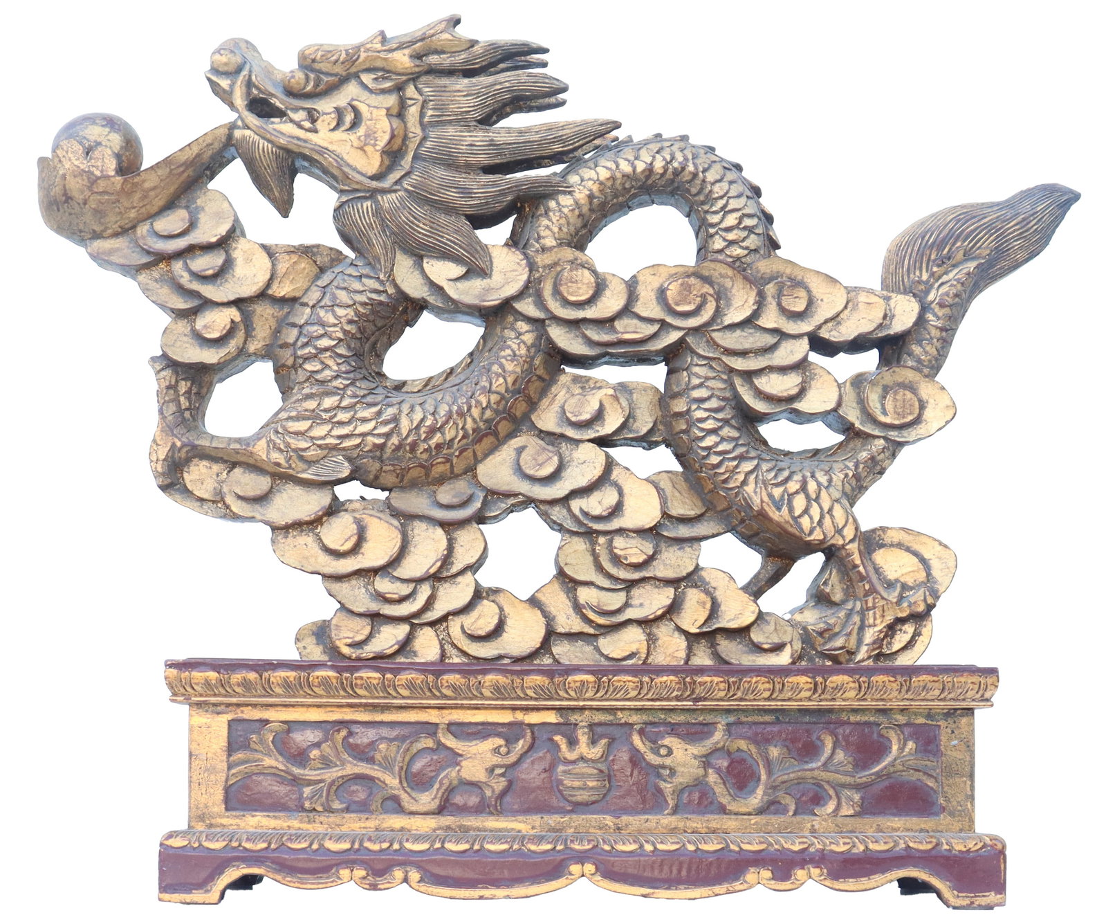 Vintage Chinese Parcel Gilt Carved Wood Dragon: Vintage Chinese Parcel Gilt Carved Wood Dragon. Carved wood dragon with parcel gilt accents amid clouds. With Chinese export sticker. The Chinese dragon (lóng) is a powerful and auspicious symb