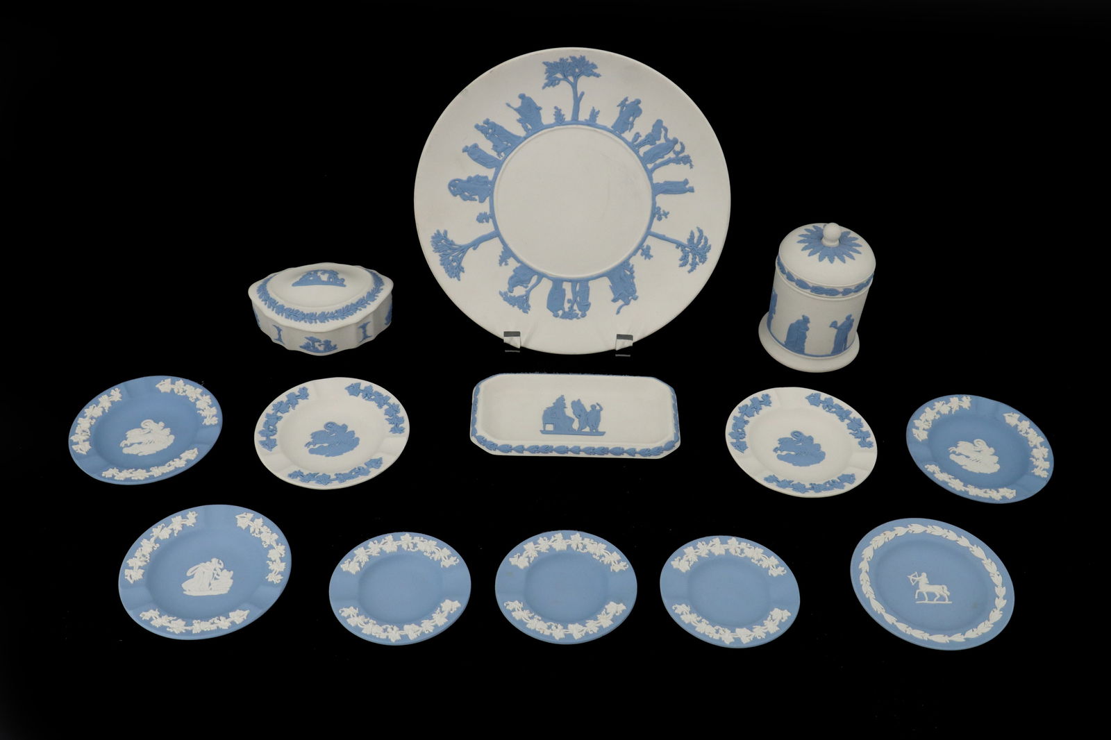 (13) English Wedgwood Porcelain Jasperware with Original Boxes: (13) English Wedgwood Porcelain Jasperware with Original Boxes. Includes nine small round plates, one small rectangular plate, one large round plate, one round sugar bowl, and one triangular covered d