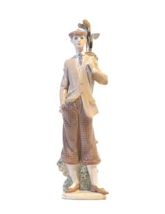 Spanish Lladro Porcelain Male Golfer Sculpture with Original Box: Spanish Lladro Porcelain Male Golfer Sculpture with Original Box. A jaunty gentleman waiting to tee off, leaning against a bush, his back very straight, his golf bag slung over his shoulder. Marked on